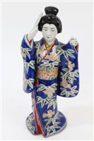 Lot 159 - Late 19th century Japanese porcelain figure of...