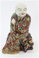 Lot 34 - Late 19th century Japanese porcelain figure of...