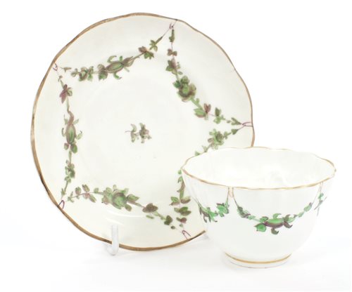 Lot 92 - Bristol-style tea bowl and saucer with green...