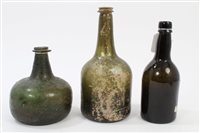 Lot 111 - Two 18th century green glass wine bottles with...