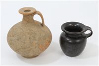 Lot 112 - Roman red terracotta bulbous bottle with loop...