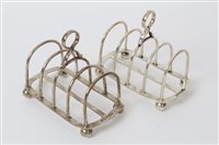 Lot 370 - Pair George V silver four-division toast racks...