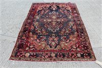 Lot 1459 - Persian Lilian rug - aubergine field centred...