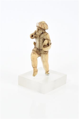 Lot 692 - Early German carved ivory figure in prancing...