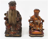 Lot 857 - Two late 19th century Chinese carved wooden...