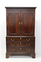 Lot 1437 - George III mahogany linen press of diminutive...