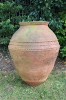 Lot 1366 - Massive terracotta garden urn of swollen form,...