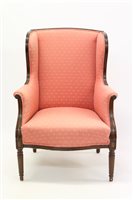 Lot 1385 - Edwardian mahogany wing armchair upholstered...