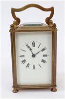 Lot 1266 - Late 19th century brass carriage clock with...