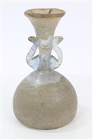 Lot 191 - Roman glass vase with flared neck, two scroll...