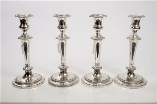 Lot 221 - Set of four 19th century EPNS candlesticks...