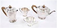 Lot 230 - Late 1940s four piece silver tea set -...