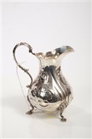 Lot 319 - Victorian silver cream jug of baluster form,...