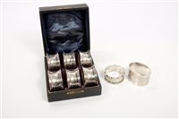 Lot 323 - Set of six Edwardian silver napkin rings of...