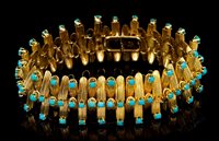 Lot 461 - Turquoise and yellow metal articulated...