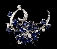 Lot 466 - 1960s diamond and sapphire floral spray brooch...