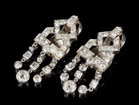 Lot 515 - Pair Art Deco diamond ear clips, each with a...