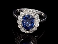 Lot 533 - Sapphire and diamond cluster ring, the oval...