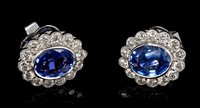 Lot 534 - Pair sapphire and diamond cluster earrings,...