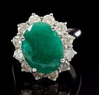 Lot 541 - Emerald and diamond cluster ring, the oval...