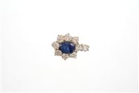 Lot 542 - Sapphire and diamond cluster pendant with an...