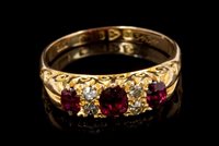 Lot 543 - Ruby and diamond ring with three oval mixed...