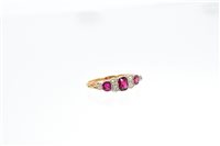 Lot 551 - Edwardian ruby and diamond ring with three...