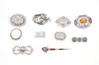 Lot 556 - Group of ten silver and white metal brooches -...