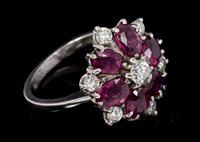 Lot 558 - Ruby and diamond cluster ring, the flower-head...