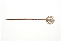 Lot 562 - Edwardian diamond stick pin with a central...