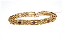 Lot 569 - Edwardian yellow metal gate bracelet, set with...