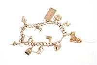 Lot 570 - Gold charm bracelet with eleven 9ct gold charms