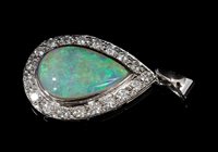 Lot 571 - Opal and diamond pendant, the pear-shape...