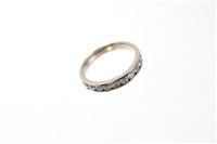 Lot 576 - Diamond eternity ring, the half-hoop set with...