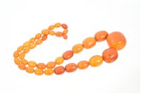 Lot 581 - Old amber necklace with a string of graduated...