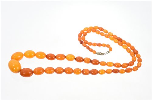 Lot 582 - Old amber necklace with a string of graduated...