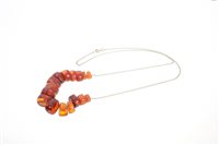 Lot 583 - Amber necklace with sixteen graduated amber...