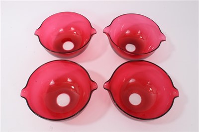 Lot 146 - Set of four 19th century ruby glass rinsers with twin spouts, 15cm
