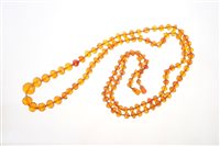 Lot 590 - Old amber necklace with a string of graduated...