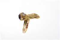 Lot 593 - Regency-style gold ring in the form of a hand...