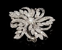 Lot 473 - Diamond floral spray brooch, the stylised...