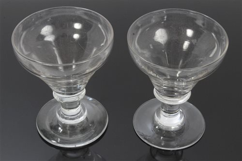 Lot 121 - Pair George III glass rummers with knopped...