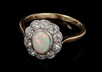 Lot 491 - Opal and diamond cluster ring, the oval...