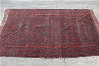 Lot 1399 - Antique Bokhara style rug, brick-red ground...