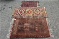 Lot 1395 - Bokhara style rug, having central...