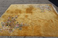 Lot 1384 - Very large Chinese wool rug with Oriental...