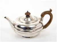 Lot 330 - Edwardian silver teapot of compressed form,...