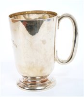 Lot 271 - 1920s silver mug of cylindrical tapering form,...