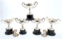 Lot 272 - Four 1930s silver golfing trophy cups on...