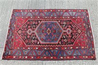 Lot 1391 - Iranian rug with central geometric medallion...